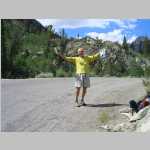 Brian at trailhead with stashed beer and bonus trash