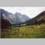 Looking down Chicago Basin (ele 11200 ft). Base Camp Animas is located in the grove of trees just ahead.