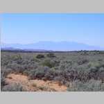 Along Flint Flat with snake in road and Henry Mountains