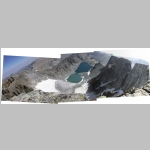 View looking east and down from Cloud Peak summit. The bottom of the photo shows the edge of 1000+ foot dropoff. Glacier Lake in the picture.