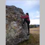 Ted climbing boulder above